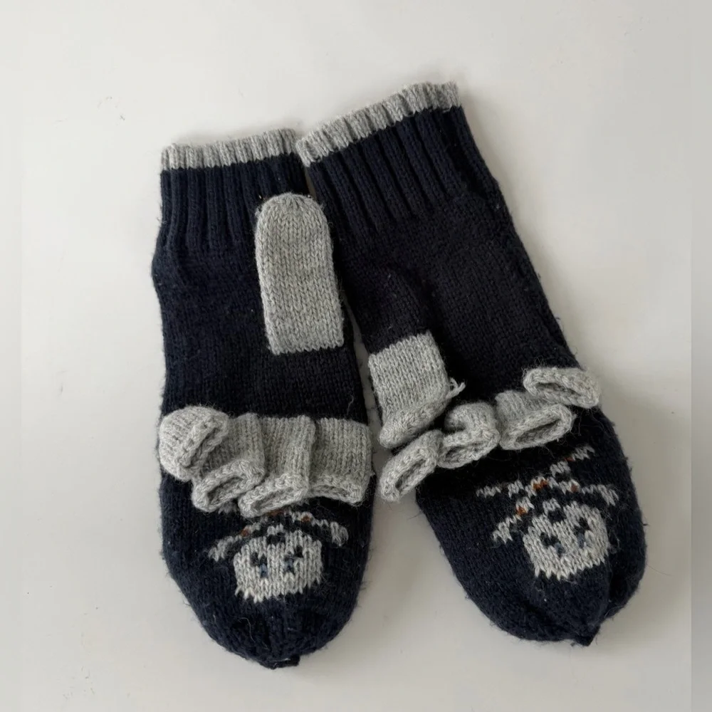 Zara knit fingerless gloves featuring a skull design